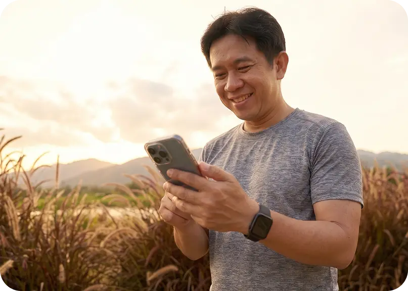 Man using phone outdoors